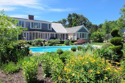 65 Captains Walk North Chatham, MA 02650 - Photo 2 of 13 a front view of a house with a yard