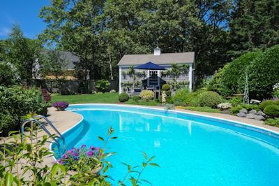 65 Captains Walk North Chatham, MA 02650 - Photo 3 of 13 a view of a backyard with swimming pool