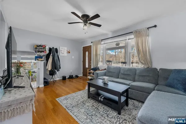 a living room with furniture and a flat screen tv