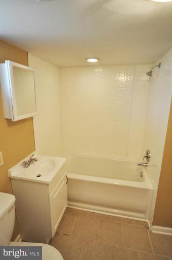 4 Rollwin Road Windsor Mill, MD 21244 - Photo 23 of 24 a bathroom with a sink a toilet and shower