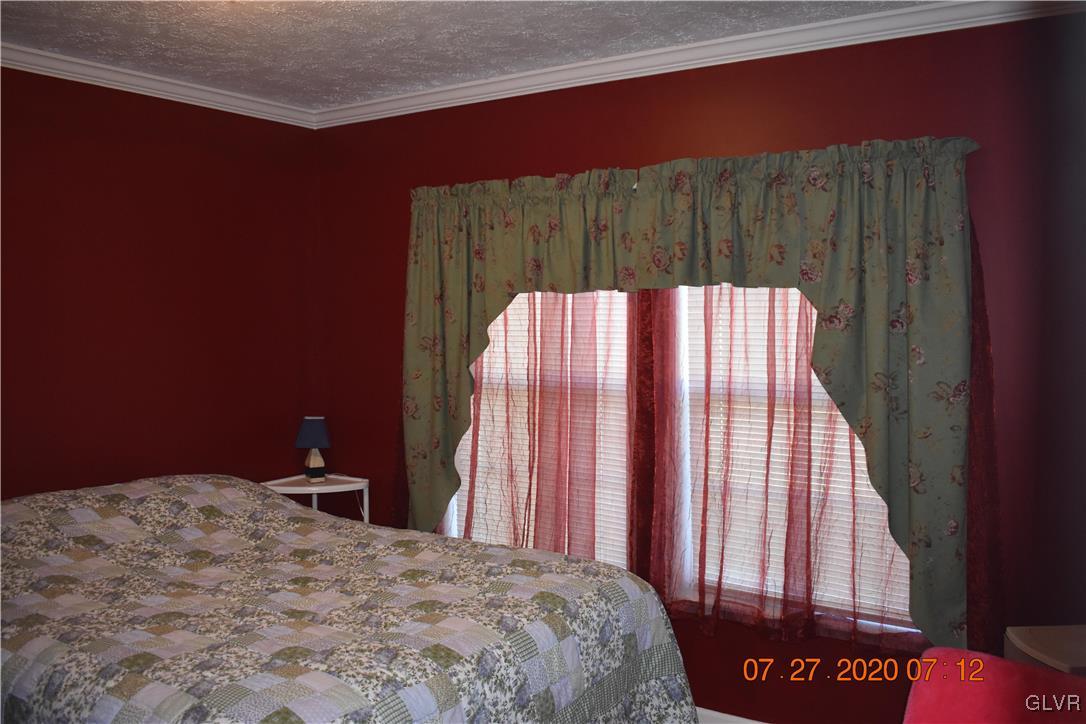 1168 Clearfield Road Nazareth, PA 18064 - Photo 13 of 19 a bed sitting in a bedroom next to a window