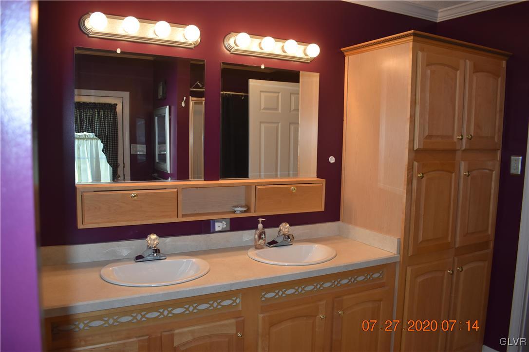 1168 Clearfield Road Nazareth, PA 18064 - Photo 14 of 19 a bathroom with a sink and a mirror