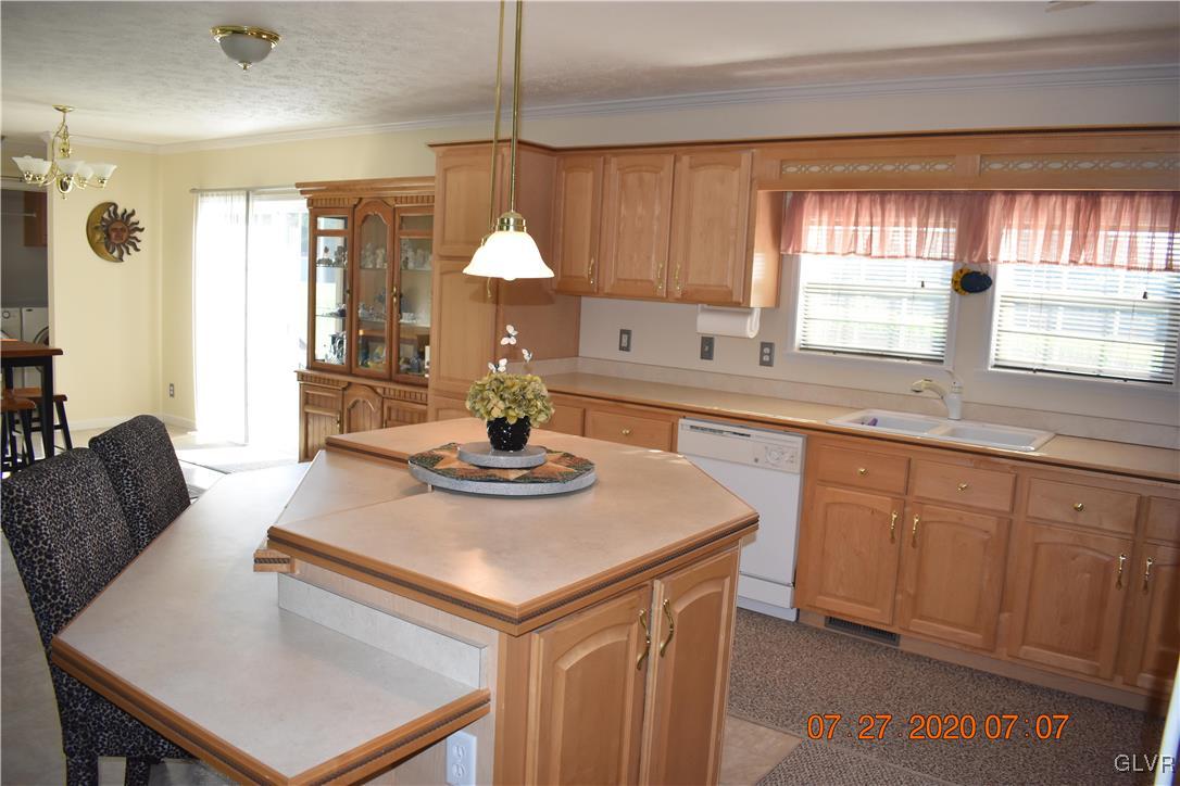 1168 Clearfield Road Nazareth, PA 18064 - Photo 4 of 19 a kitchen with a sink a counter space and dining table
