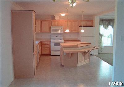 1168 Clearfield Road Nazareth, PA 18064 - Photo 5 of 19 a kitchen with a table chairs and a stove
