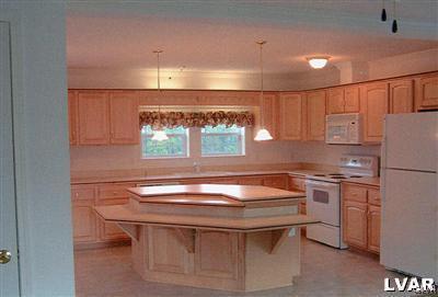 1168 Clearfield Road Nazareth, PA 18064 - Photo 6 of 19 a kitchen with kitchen island a sink stove and cabinets