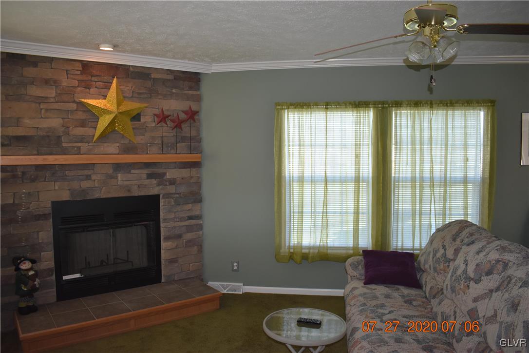 1168 Clearfield Road Nazareth, PA 18064 - Photo 7 of 19 a living room with furniture and a fireplace