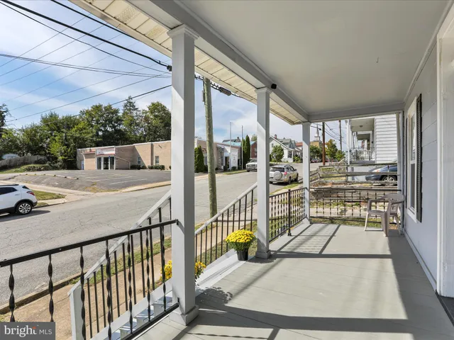 a view of a porch with wooden floor