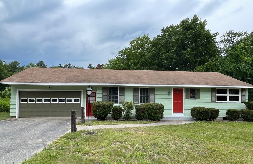 4188 Main Street Palmer, MA 01069 - Photo 1 of 22 a front view of a house with a yard and garage