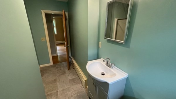4188 Main Street Palmer, MA 01069 - Photo 14 of 22 a bathroom with a sink a mirror and a toilet