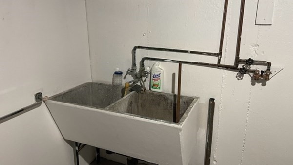 4188 Main Street Palmer, MA 01069 - Photo 16 of 22 a view of a sink a refrigerator and wooden floor