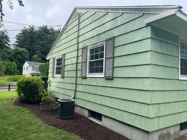 4188 Main Street Palmer, MA 01069 - Photo 4 of 22 a front view of a house with a garden