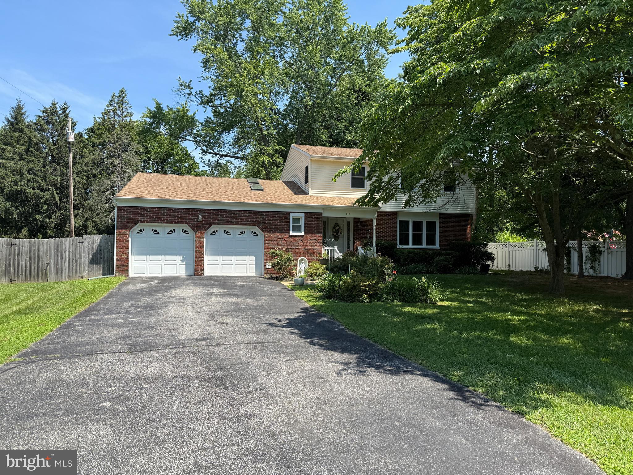 114 Salina Road Sewell, NJ 08080 - Photo 2 of 86 a front view of a house with a yard and garage