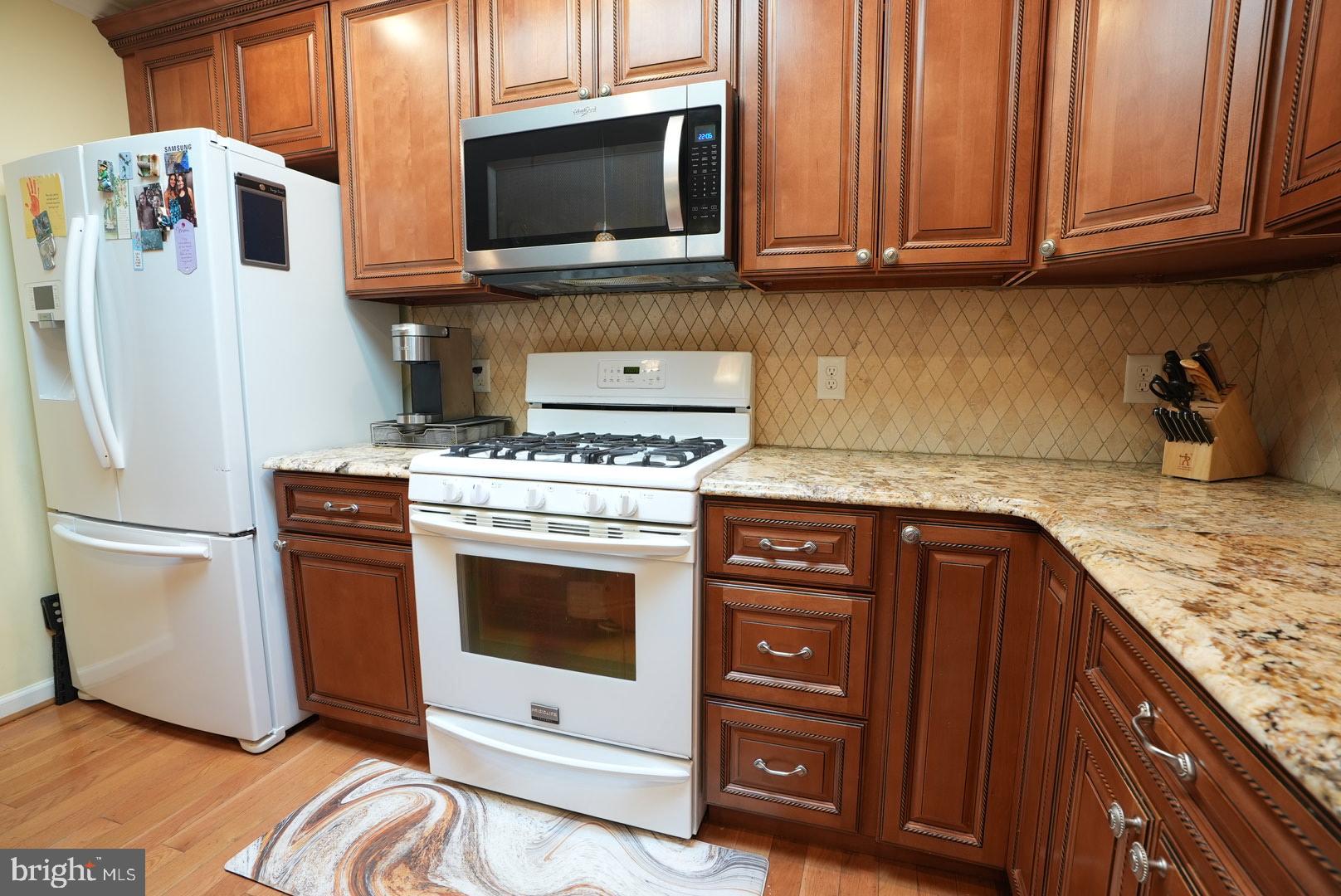 114 Salina Road Sewell, NJ 08080 - Photo 22 of 86 a kitchen with stainless steel appliances granite countertop a refrigerator stove and microwave