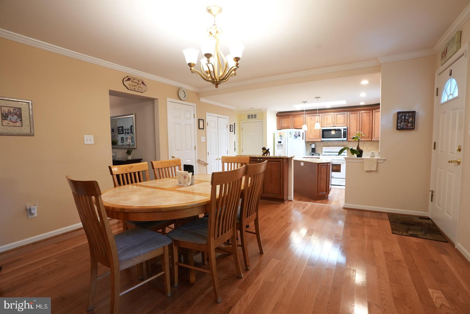 114 Salina Road Sewell, NJ 08080 - Photo 27 of 86 a view of a dining room with furniture wooden floor and chandelier