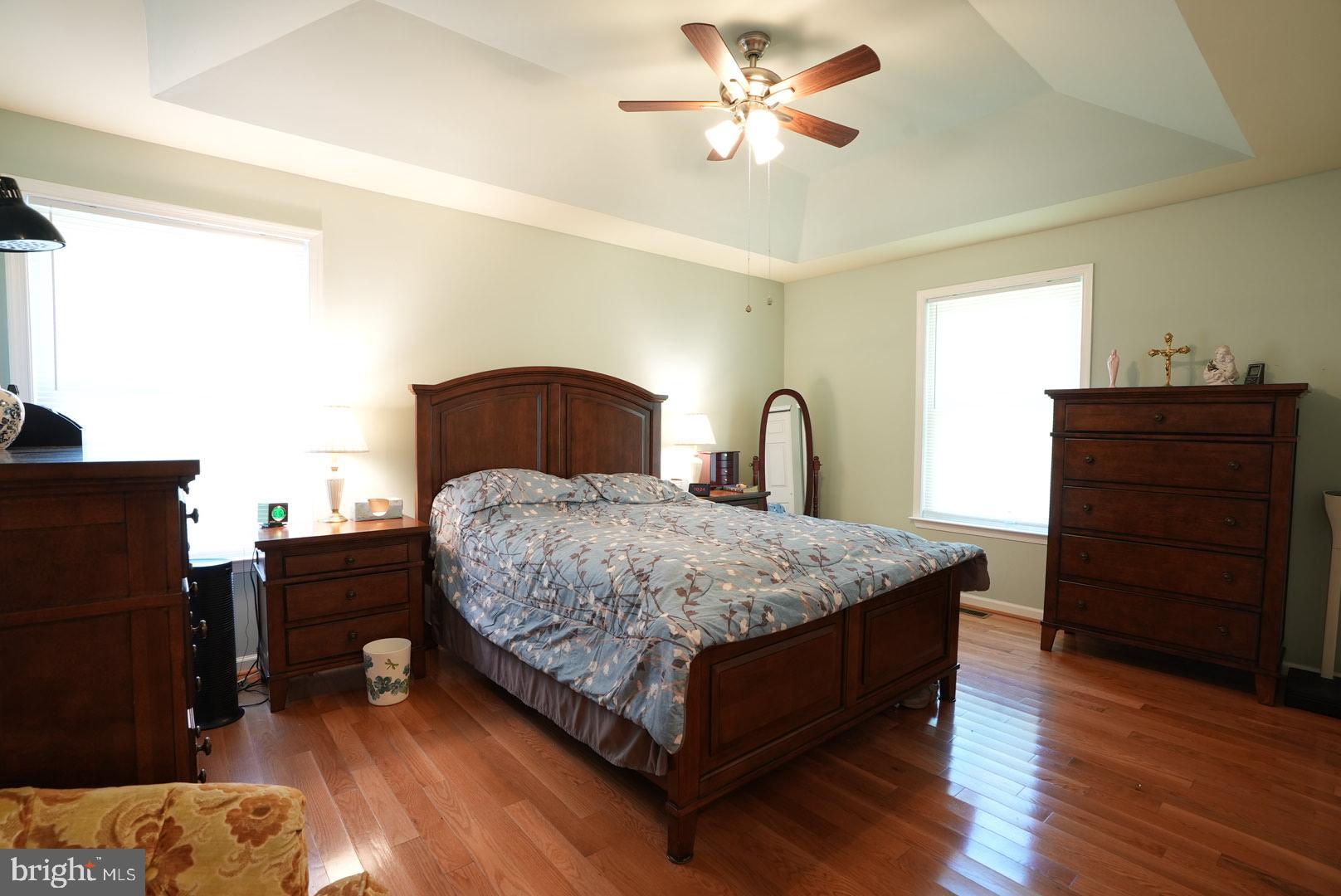 114 Salina Road Sewell, NJ 08080 - Photo 35 of 86 a bedroom with a bed and wooden floor