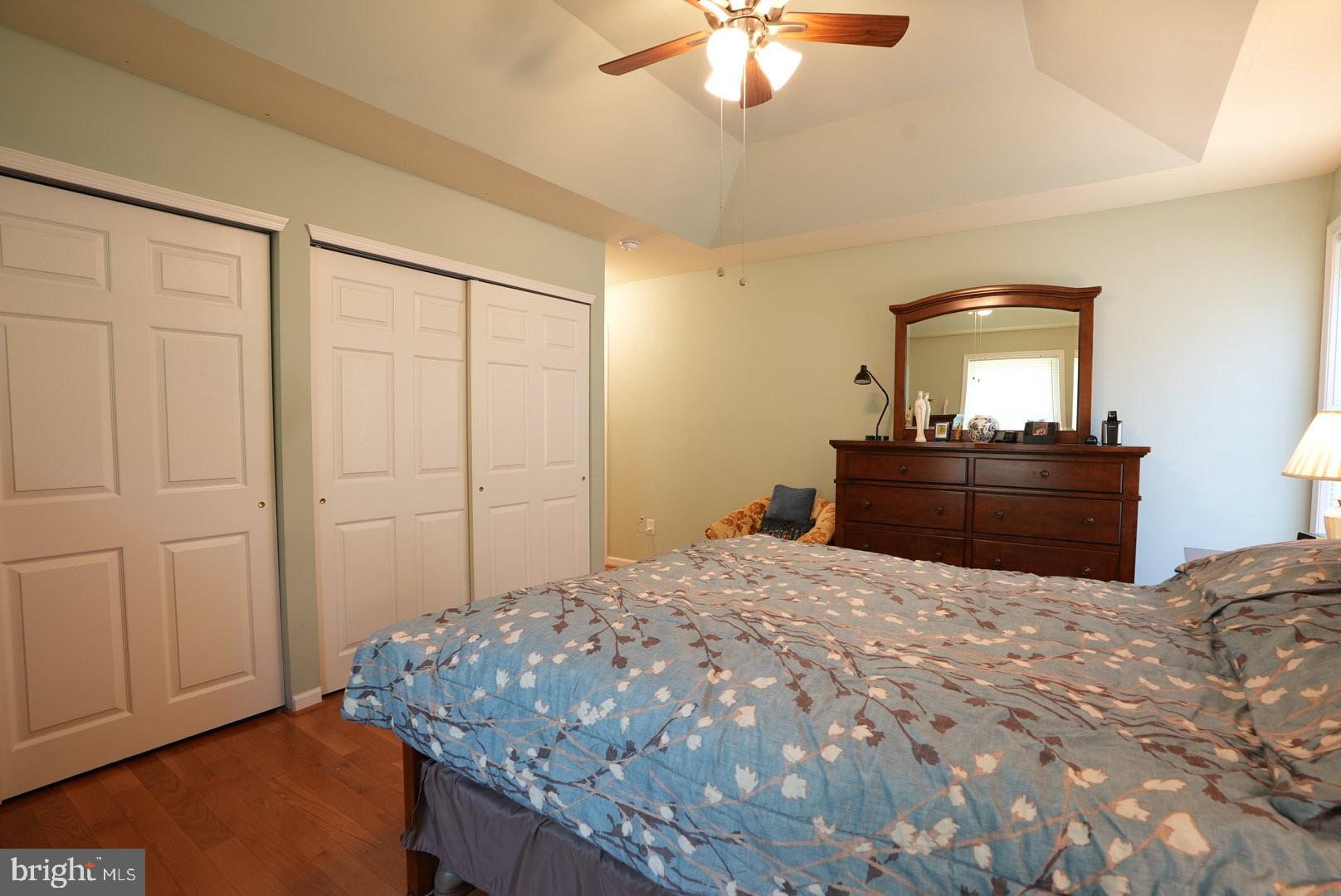 114 Salina Road Sewell, NJ 08080 - Photo 38 of 86 a bedroom with a bed and a chandelier