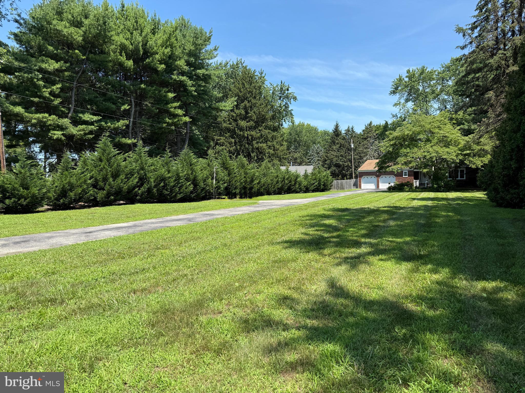 114 Salina Road Sewell, NJ 08080 - Photo 41 of 86 a view of a grassy field with trees in the background