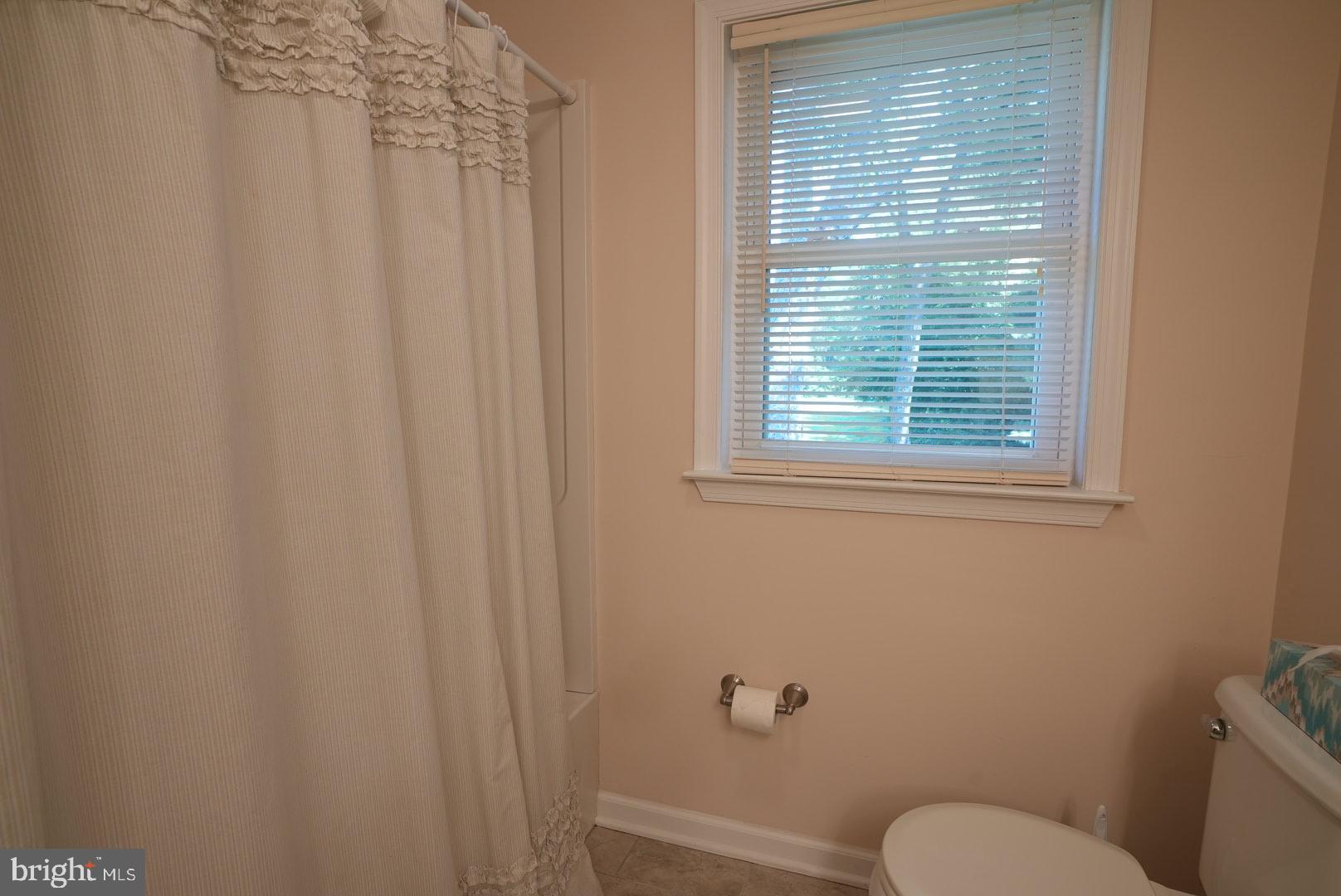 114 Salina Road Sewell, NJ 08080 - Photo 59 of 86 a white toilet sitting next to a window in a bathroom