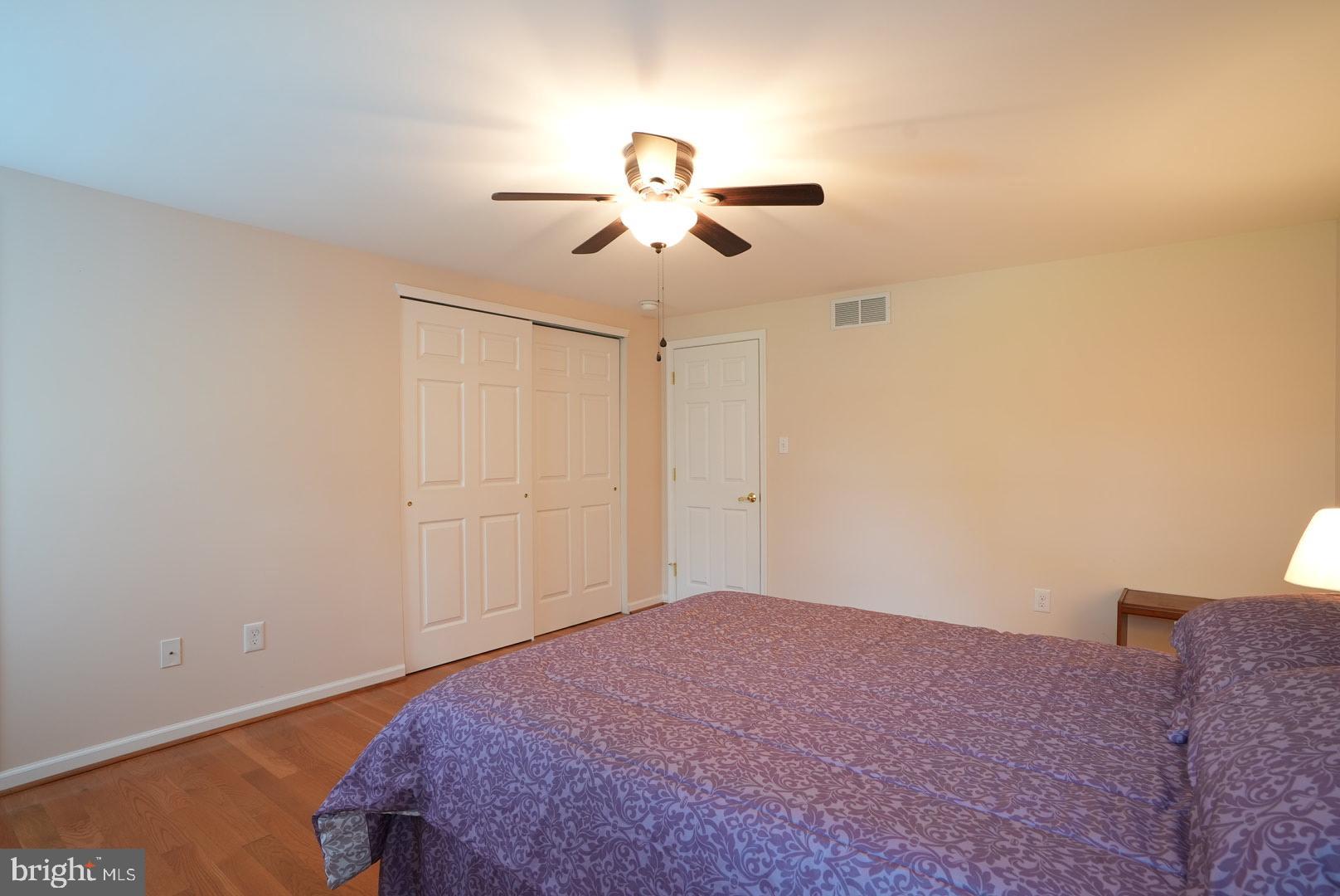 114 Salina Road Sewell, NJ 08080 - Photo 63 of 86 a bedroom with a bed and a chandelier fan