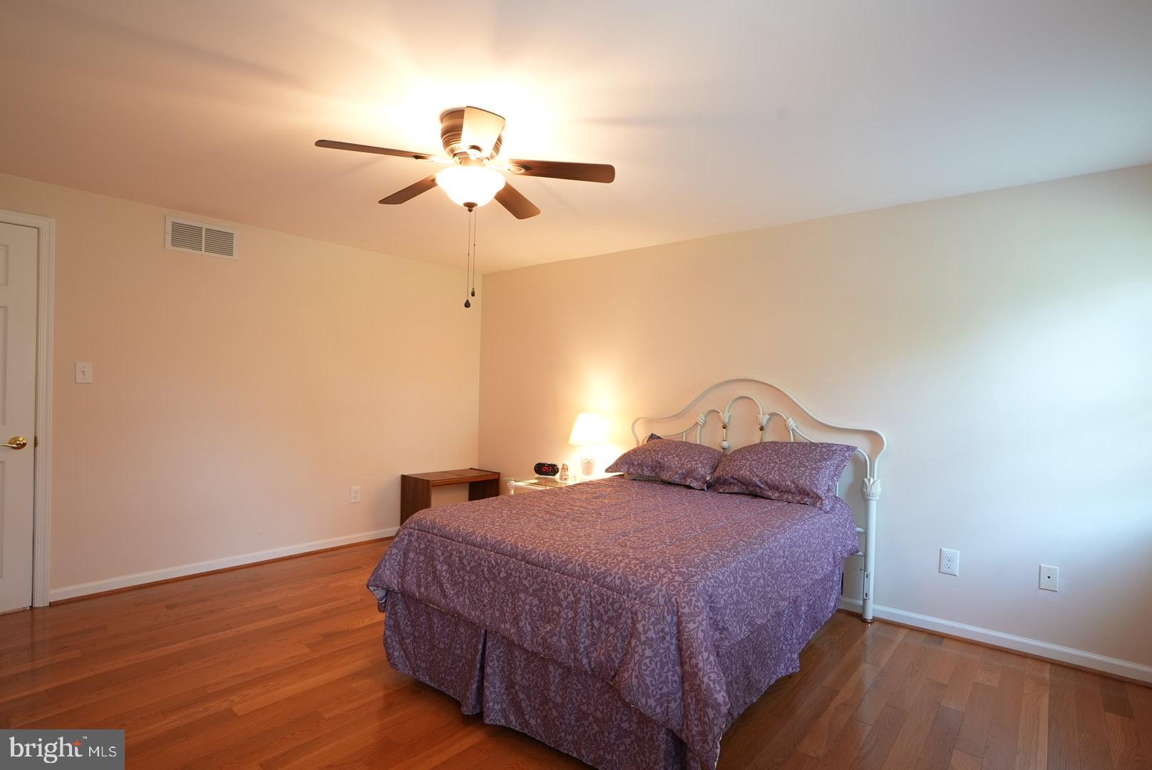 114 Salina Road Sewell, NJ 08080 - Photo 64 of 86 a bedroom with a bed and wooden floor