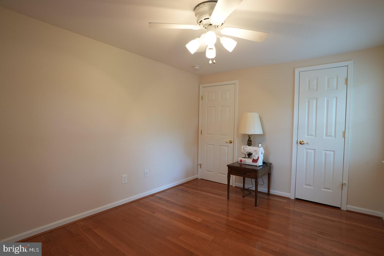 114 Salina Road Sewell, NJ 08080 - Photo 66 of 86 a view of a room with wooden floor and ceiling fan