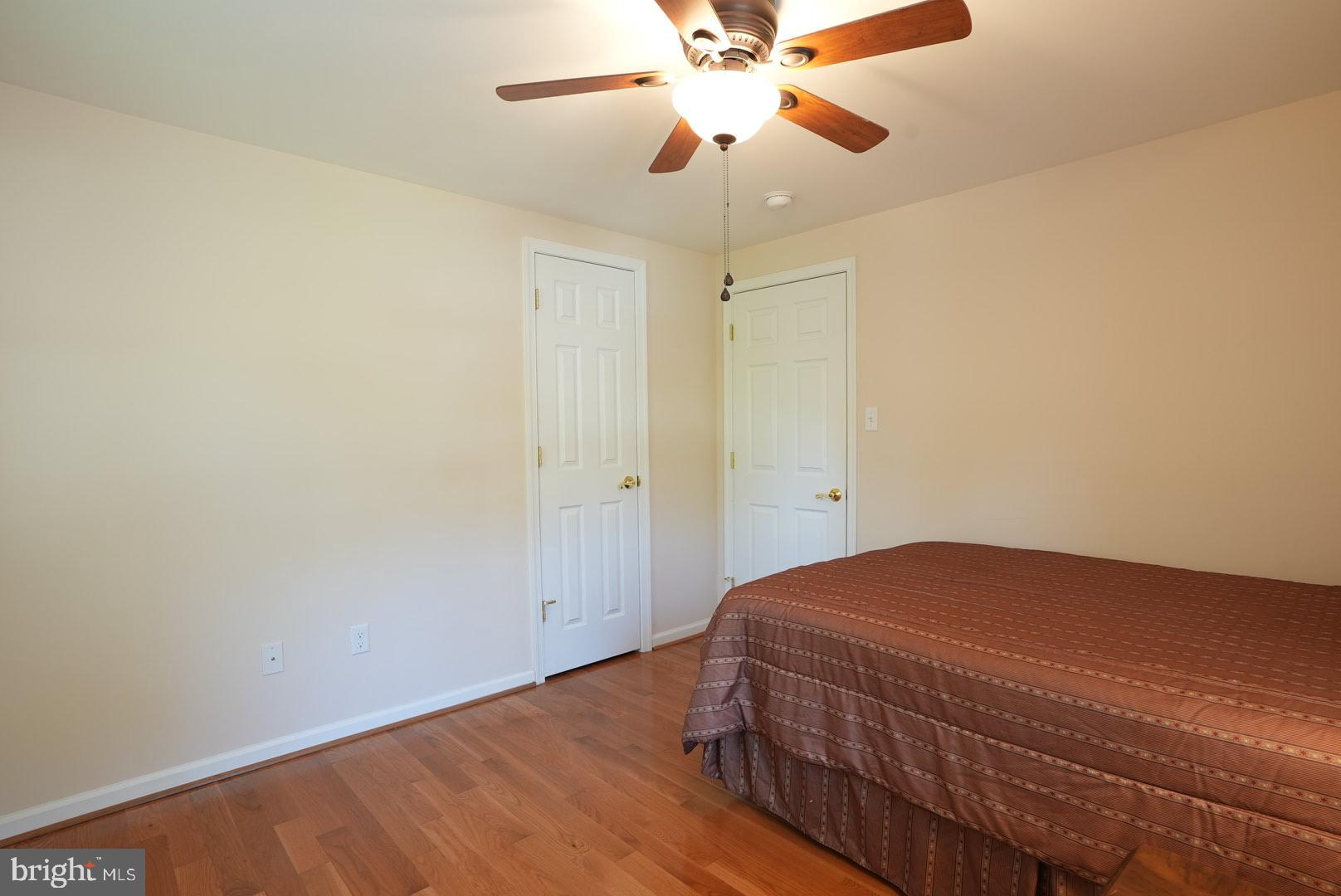 114 Salina Road Sewell, NJ 08080 - Photo 70 of 86 a bedroom with a bed and a chandelier fan