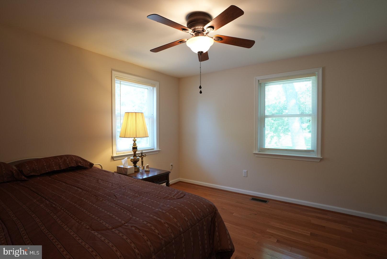 114 Salina Road Sewell, NJ 08080 - Photo 71 of 86 a bedroom with a bed and a chandelier