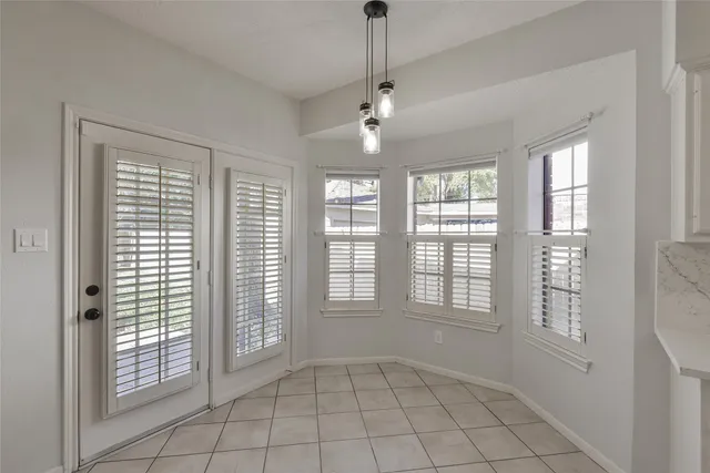 a view of an empty room with windows