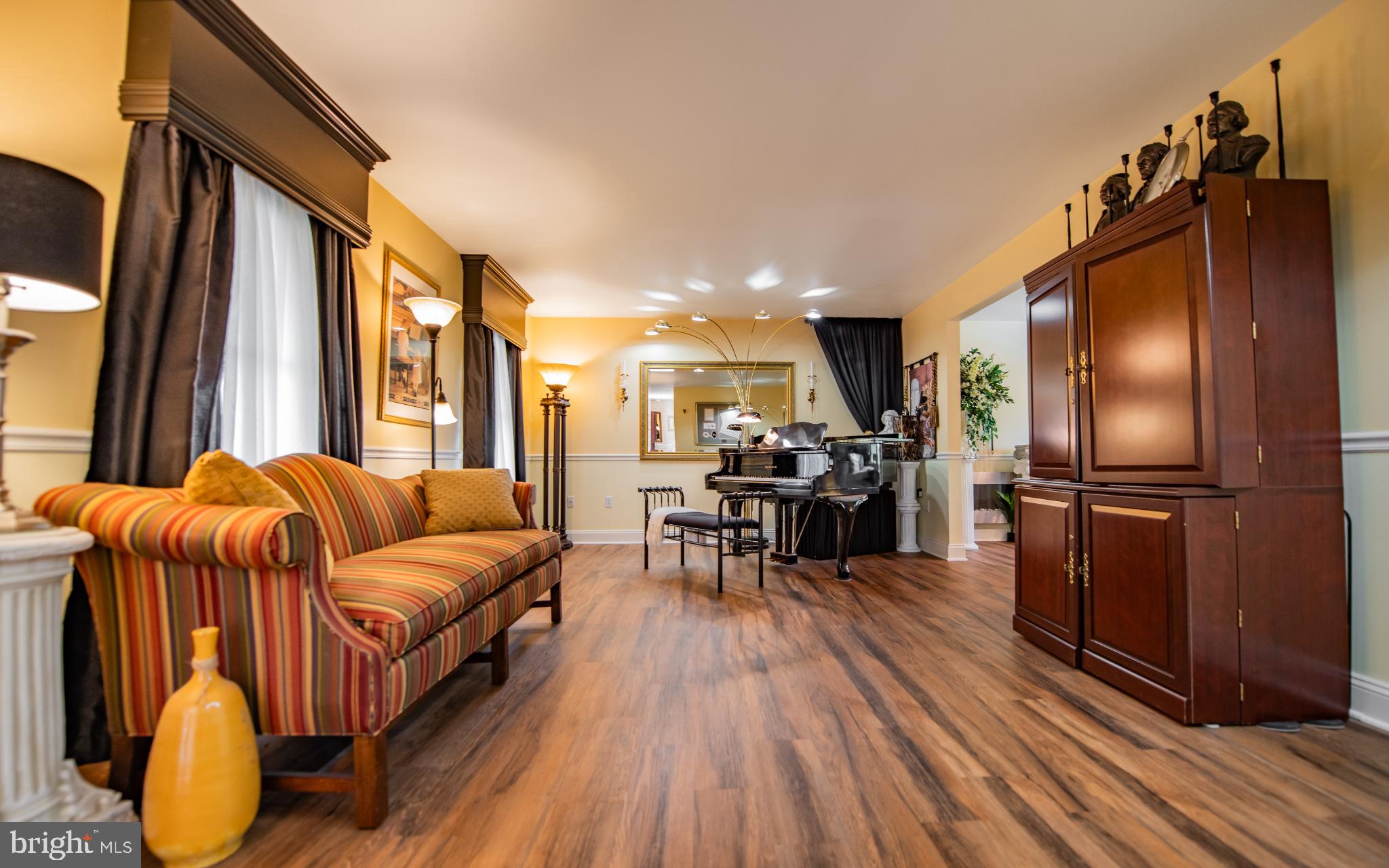 75 Pocahontas Trail Lock Haven, PA 17745 - Photo 16 of 49 a living room with furniture a fireplace and a flat screen tv
