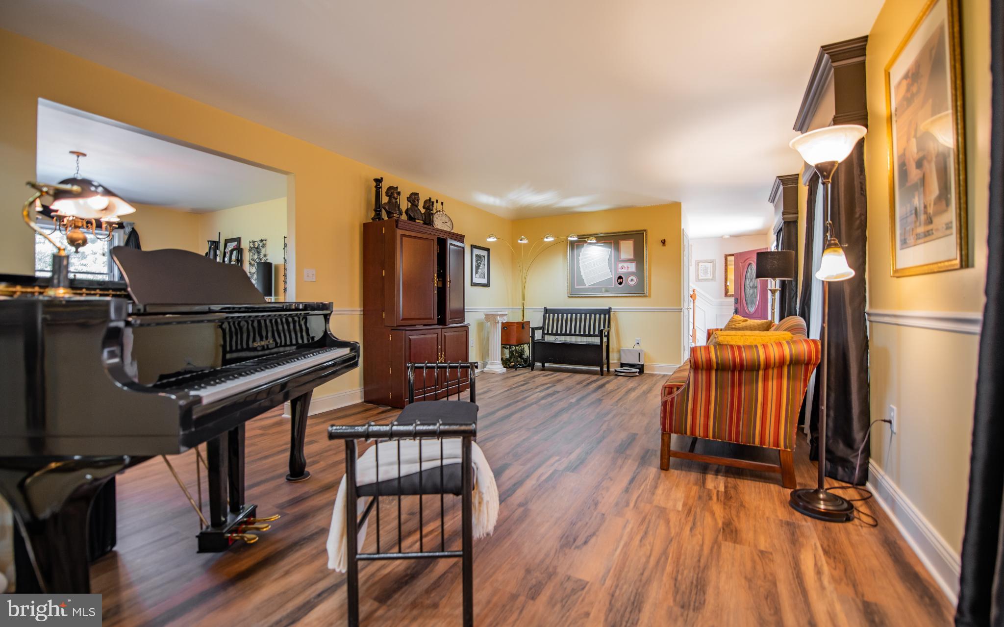 75 Pocahontas Trail Lock Haven, PA 17745 - Photo 17 of 49 a living room with furniture a fireplace and wooden floor