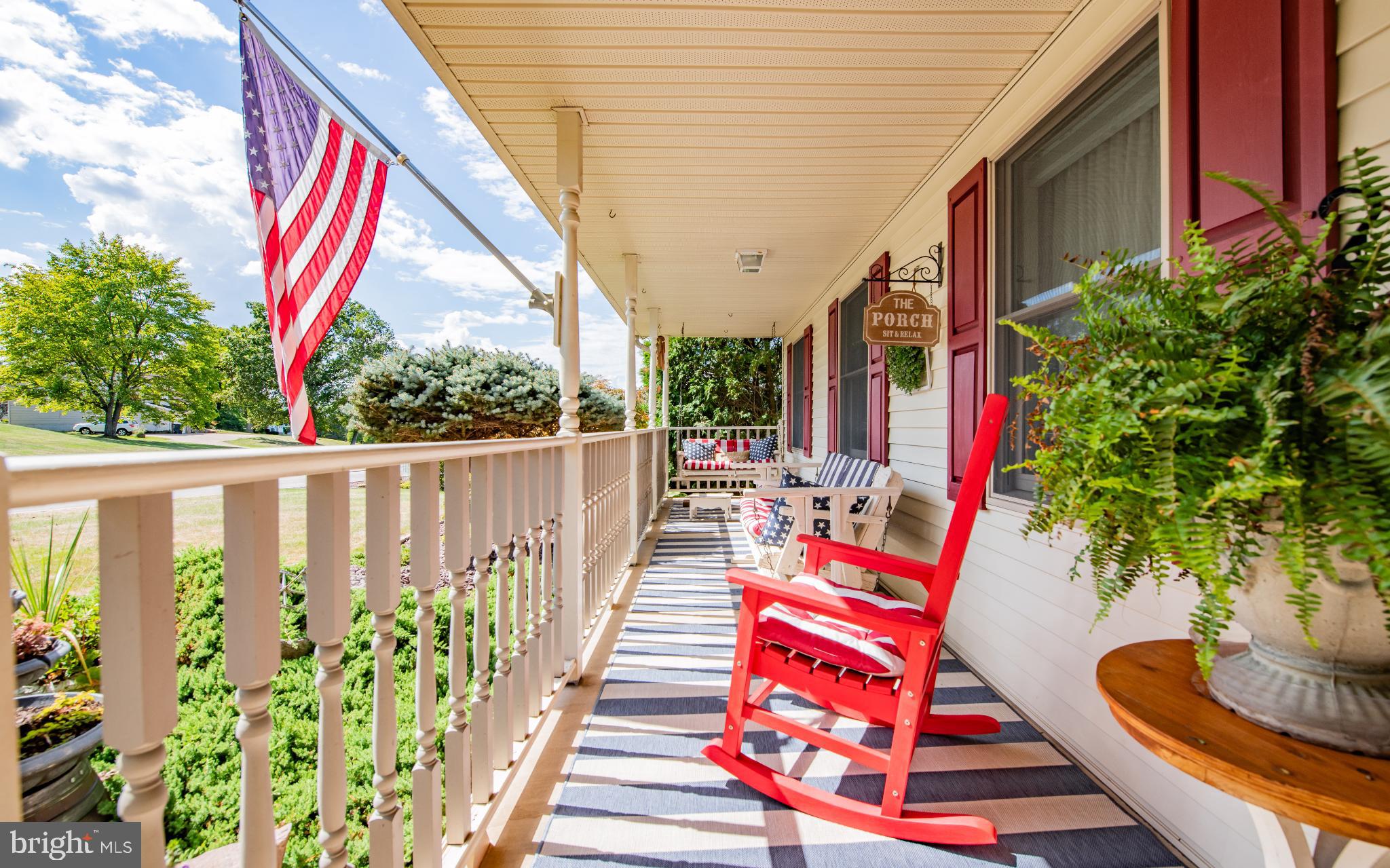 75 Pocahontas Trail Lock Haven, PA 17745 - Photo 3 of 49 a balcony view with couches and a dining table and chairs with wooden fence and plants