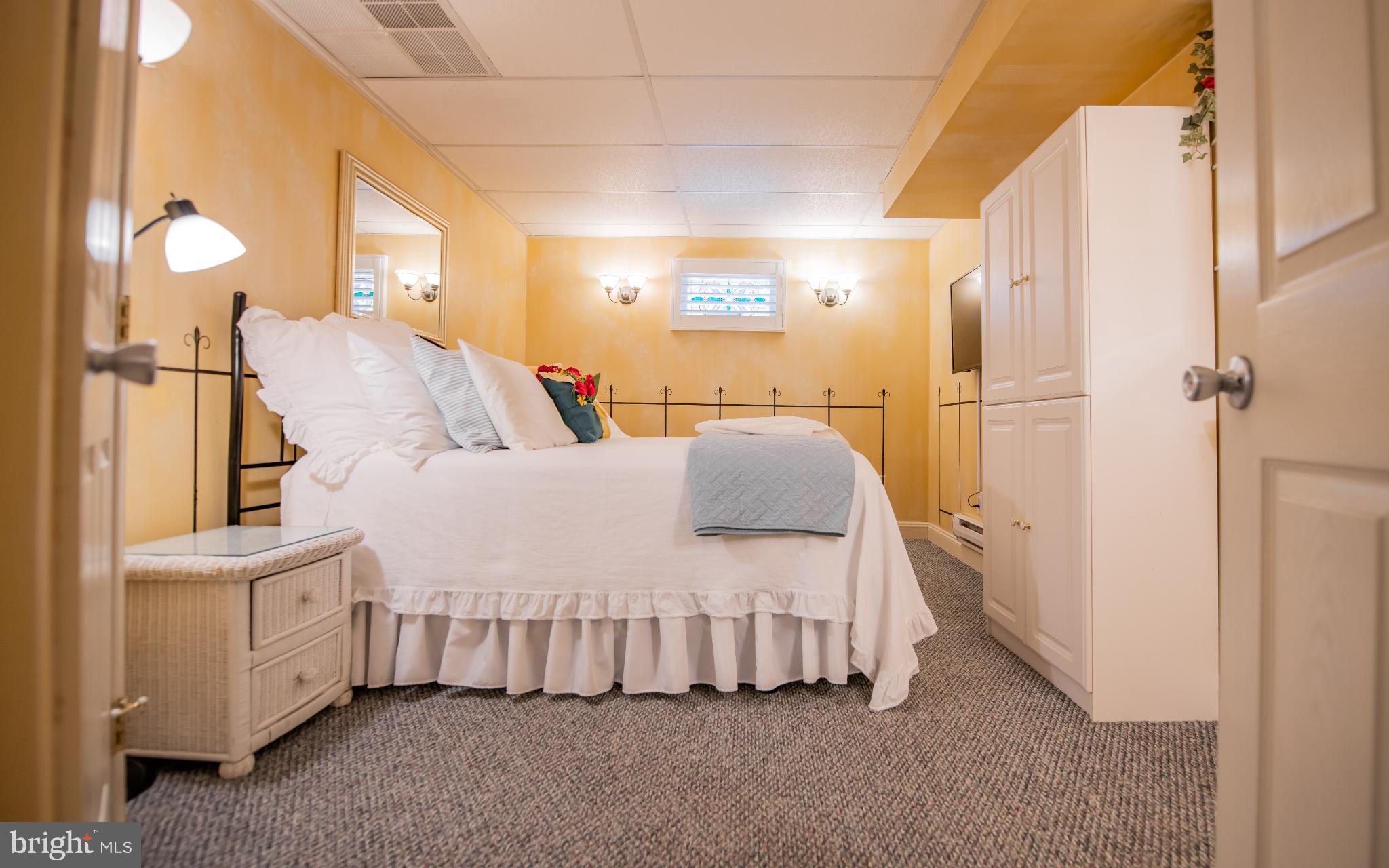 75 Pocahontas Trail Lock Haven, PA 17745 - Photo 31 of 49 a large bedroom with a bed and a chandelier