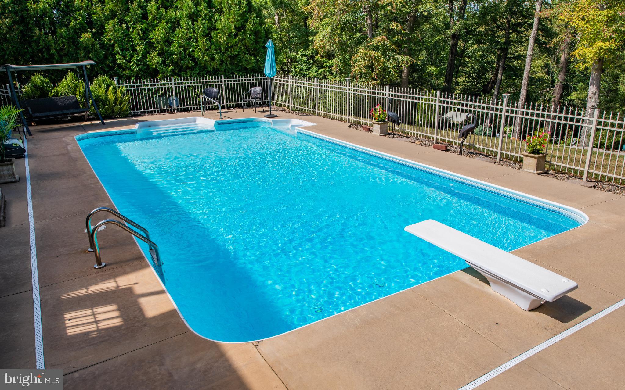 75 Pocahontas Trail Lock Haven, PA 17745 - Photo 35 of 49 a view of a swimming pool with a patio and a tub