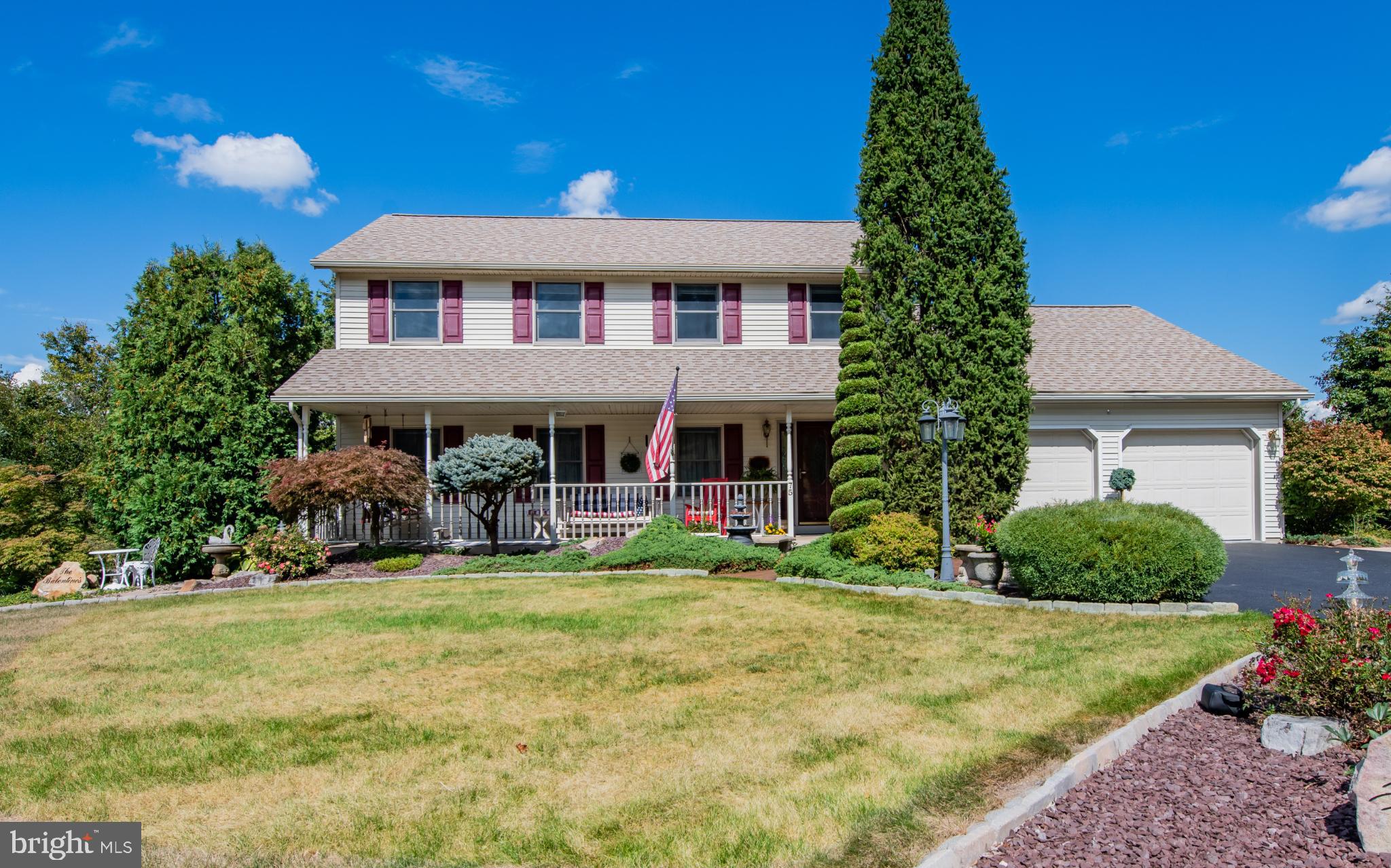 75 Pocahontas Trail Lock Haven, PA 17745 - Photo 46 of 49 a view of a house with a yard potted plants and a bench