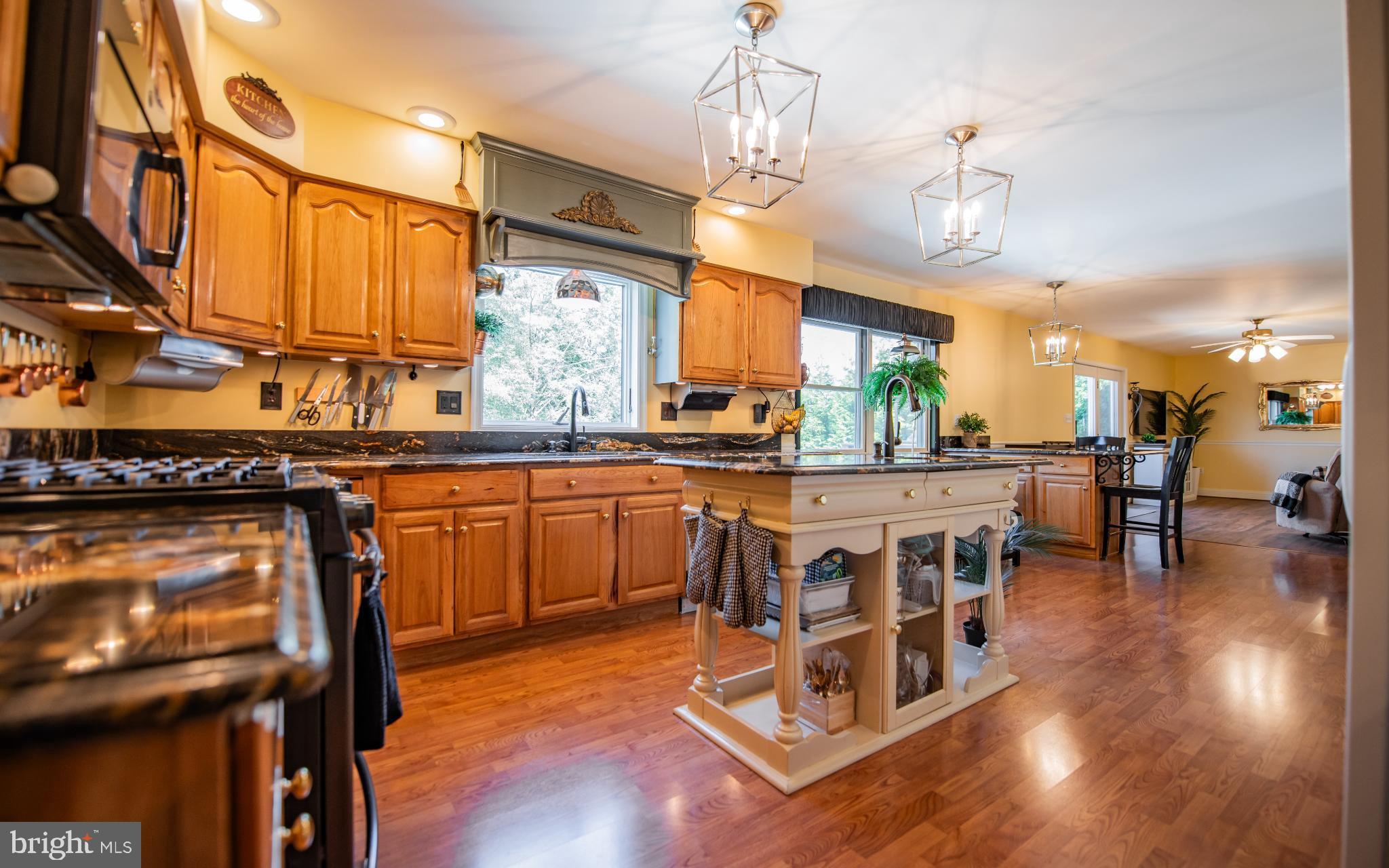 75 Pocahontas Trail Lock Haven, PA 17745 - Photo 8 of 49 a dining hall with stainless steel appliances granite countertop a stove top oven a dining table and chairs with wooden floor