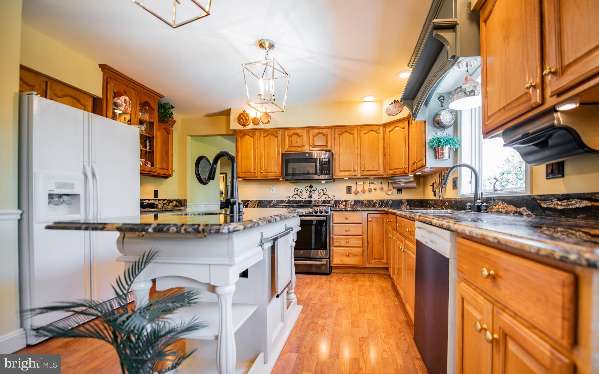 75 Pocahontas Trail Lock Haven, PA 17745 - Photo 9 of 49 a kitchen with stainless steel appliances granite countertop lots of counter top space and wooden floor