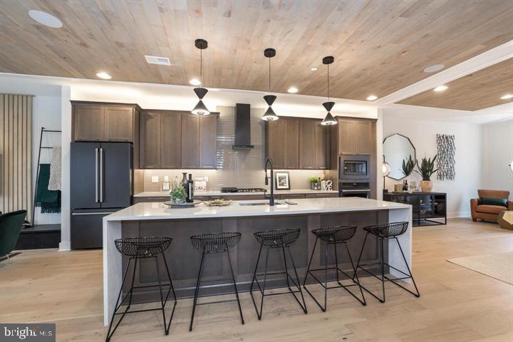 a kitchen with a table and chairs in it