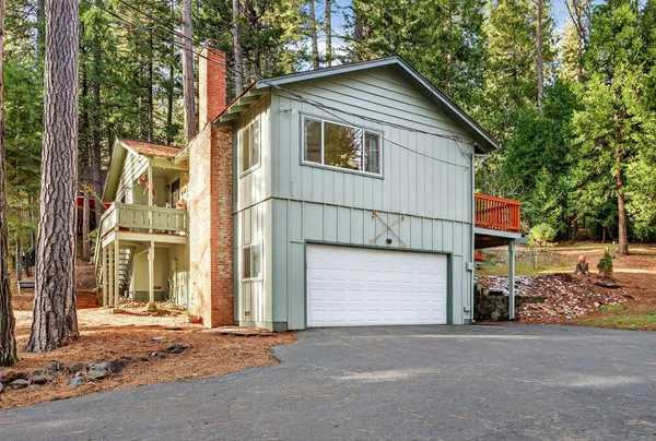 a front view of a house with a garage
