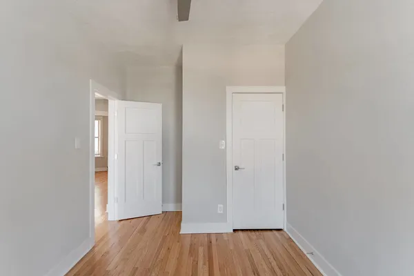 a view of a room with wooden floor