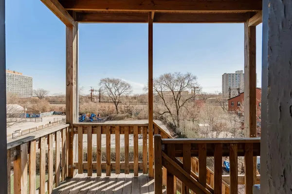 a view of a balcony with furniture