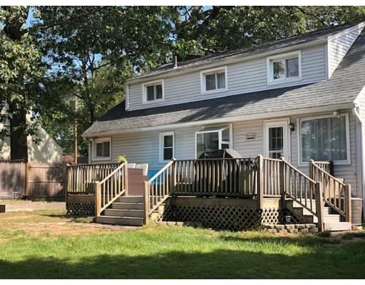 30 Bacon Road Springfield, MA 01119 - Photo 3 of 20 a view of a white house that has a small yard and large trees