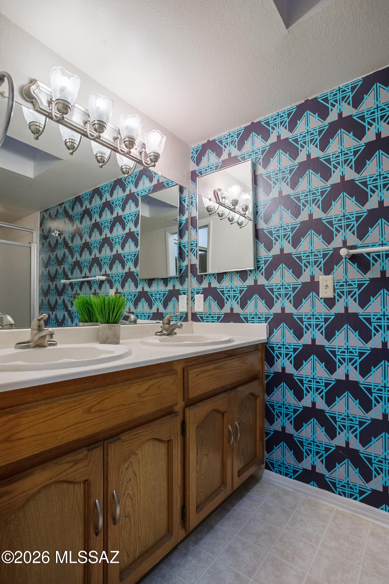 1200 East River Road, Unit B27 Tucson, AZ 85718 - Photo 31 of 40 a bathroom with a sink and a mirror