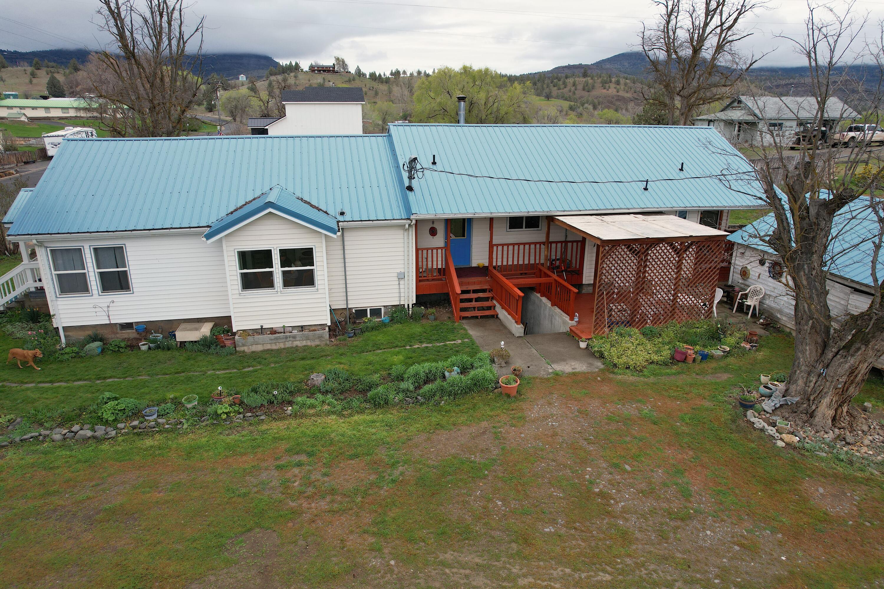 298 Main Street Monument, OR 97864 - Photo 62 of 66 an aerial view of a house with a yard