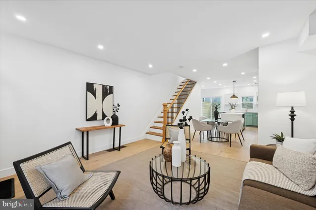 a living room with furniture and a painting