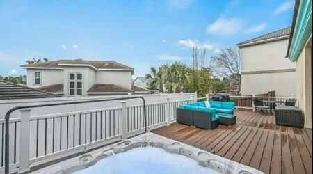 a view of a house with backyard and deck