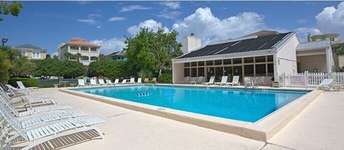 4765 Calatrava Court Destin, FL 32541 - Photo 27 of 34 a view of swimming pool with outdoor seating and yard in back