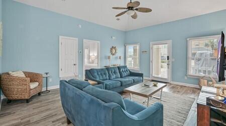 4765 Calatrava Court Destin, FL 32541 - Photo 3 of 34 a living room with furniture and a large window