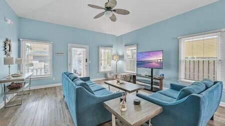 4765 Calatrava Court Destin, FL 32541 - Photo 5 of 34 a living room with furniture a wooden floor and a window