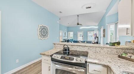 4765 Calatrava Court Destin, FL 32541 - Photo 10 of 34 a kitchen with a stove and a sink