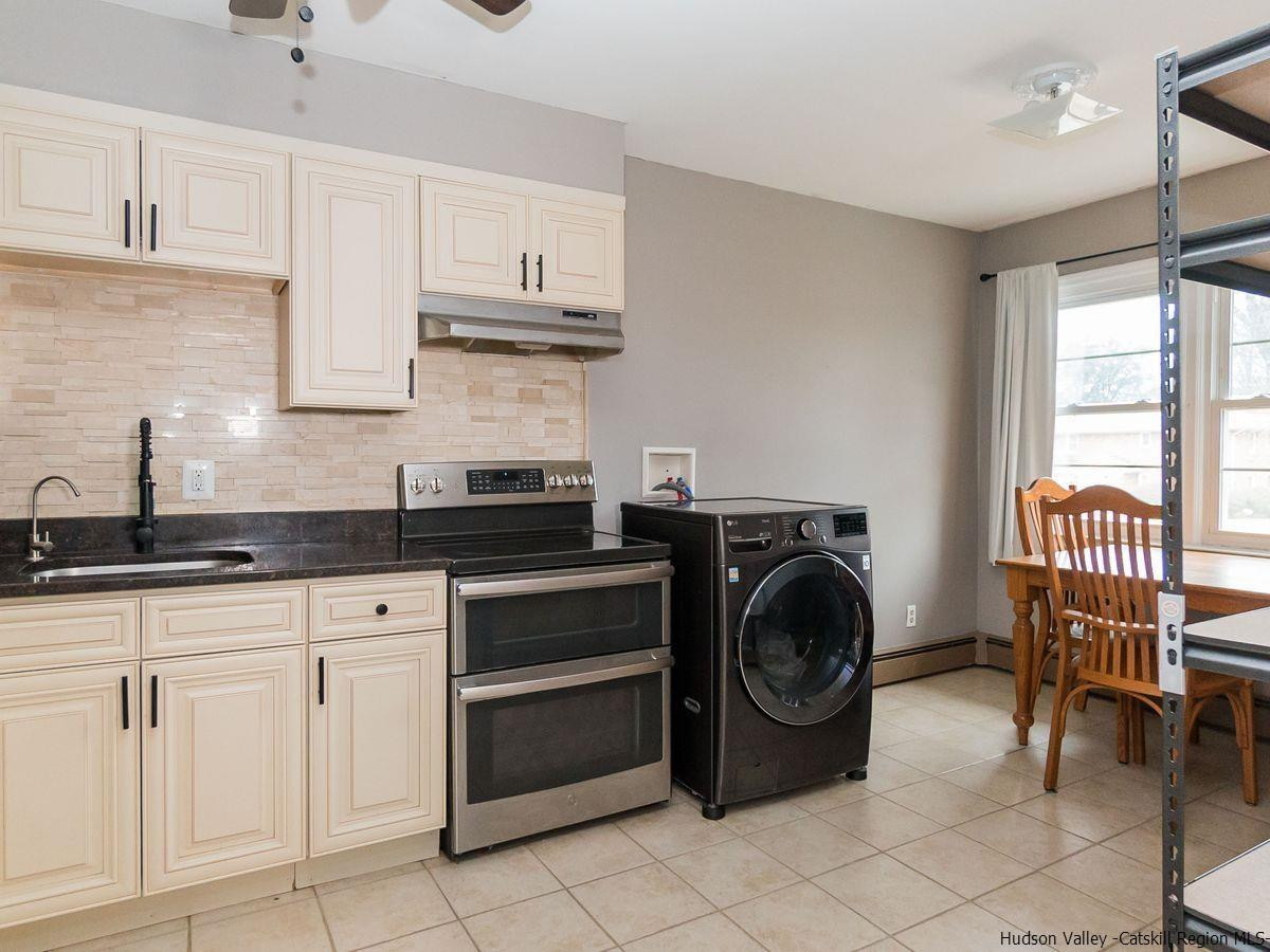 2710 South Road, Unit E4 Poughkeepsie, NY 12601 - Photo 7 of 13 a utility room with sink dryer and washer